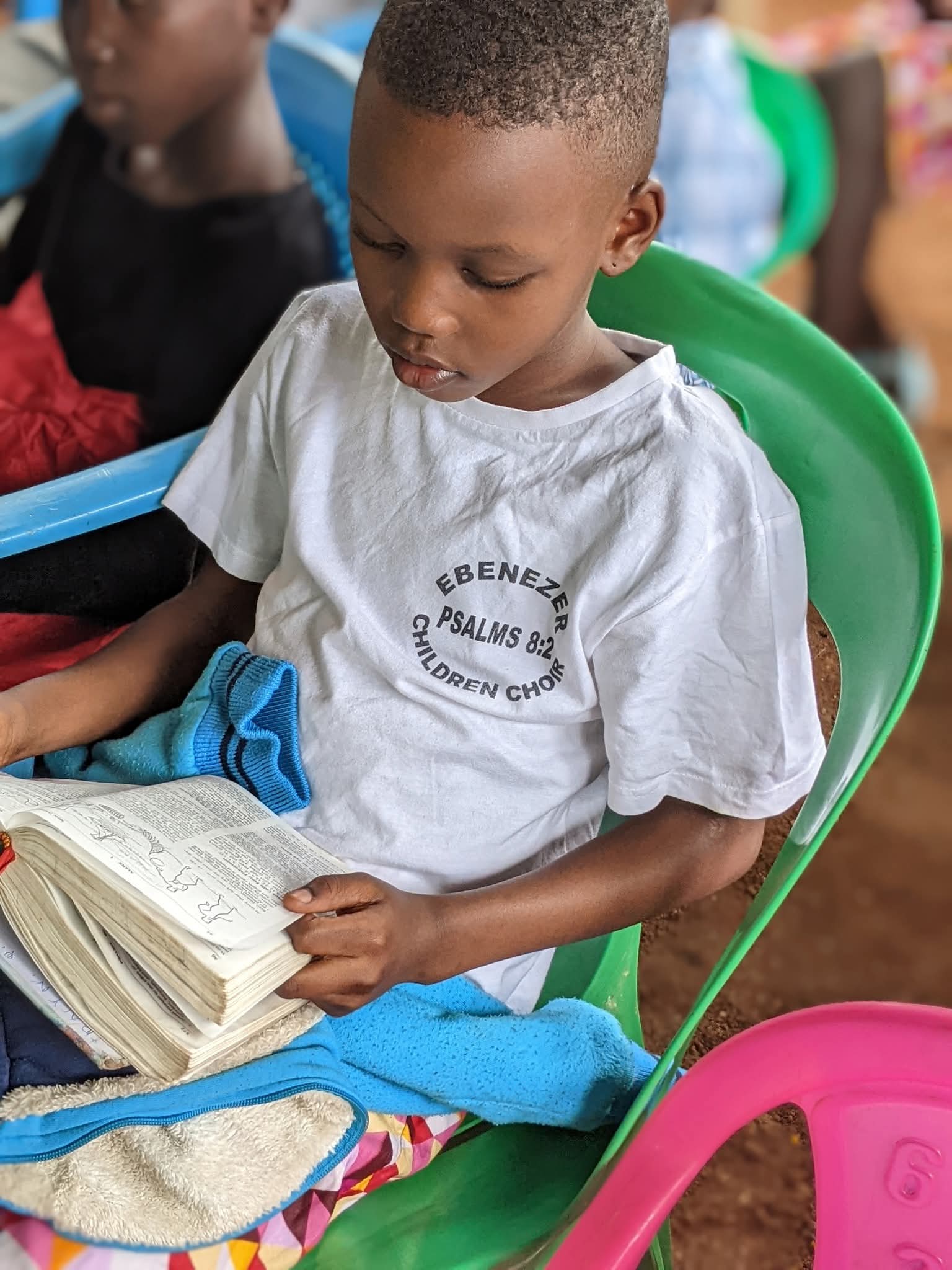 Little Boy Reading his Bible